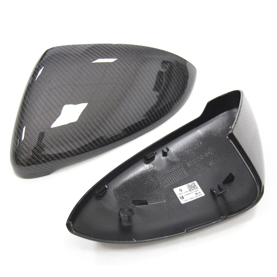 VW Golf MK7 carbon fibre mirror cover pair top and underside view showing weave pattern and fitment clips