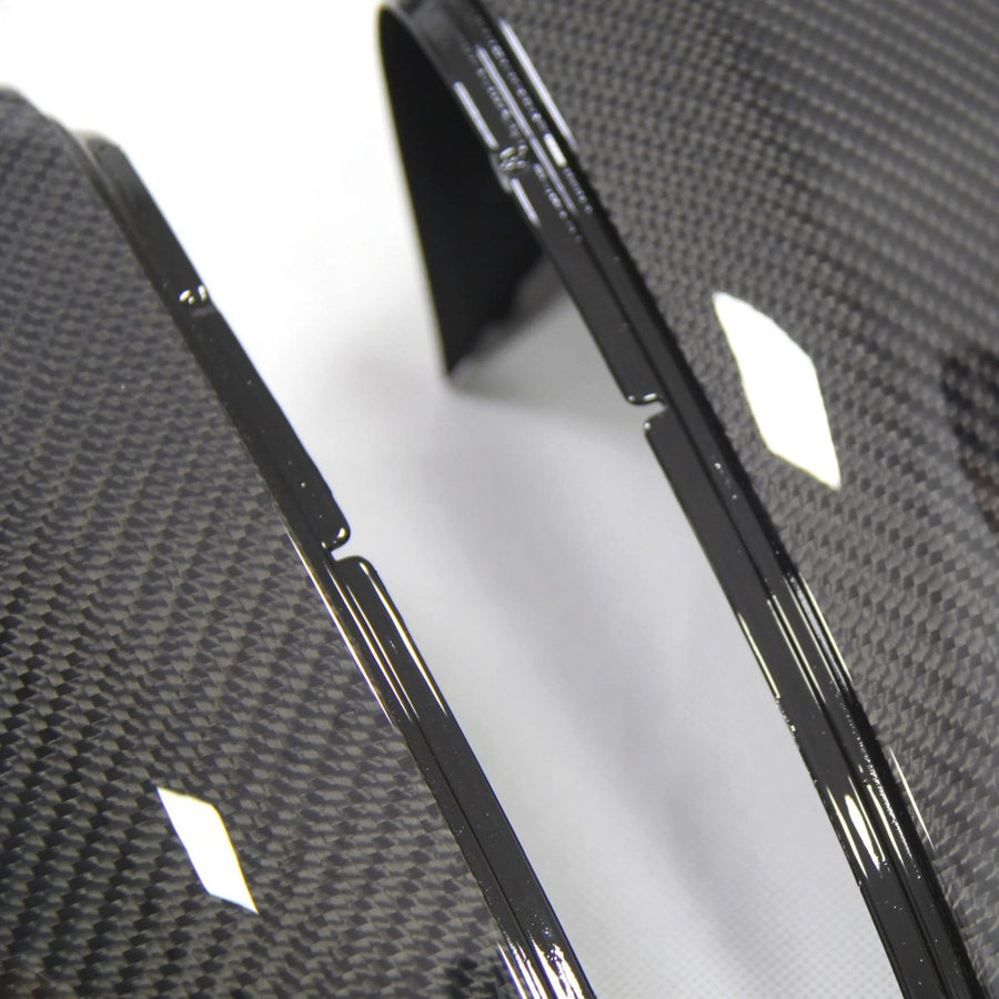 Close-up carbon fibre weave texture on VW Golf MK7 mirror cover gloss clear coat surface detail
