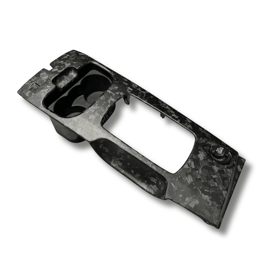 Matte forged carbon fibre shifter surround for the Ford FG Falcon, angled view on white background