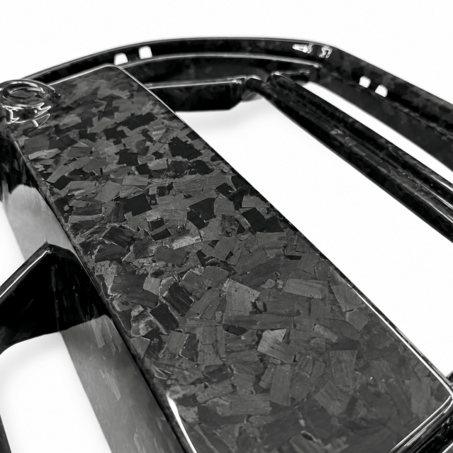 Close-up detail of forged carbon fiber weave pattern on BMW G80 M3 CSL style front kidney grille