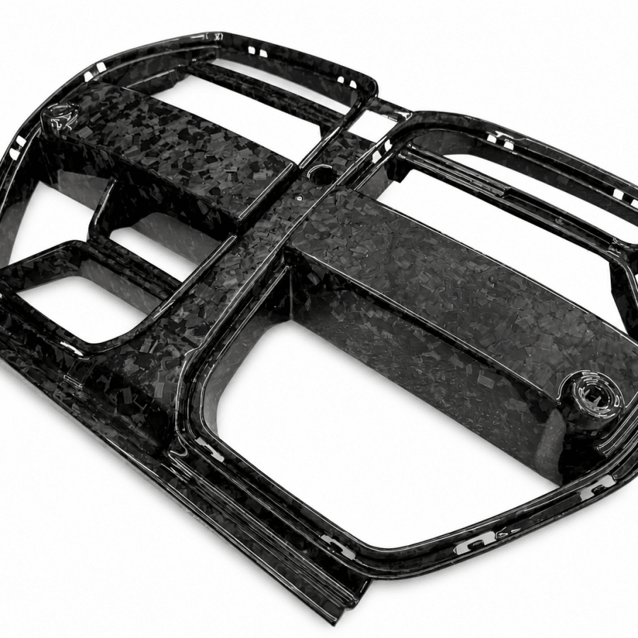 BMW G80 M3 forged carbon fiber CSL style front kidney grille for ACC equipped models, top angled view showing construction