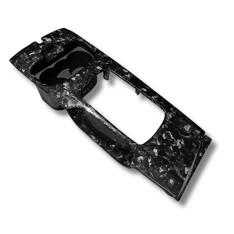 Gloss forged carbon fibre shifter surround for the Ford FG Falcon, angled view on white background