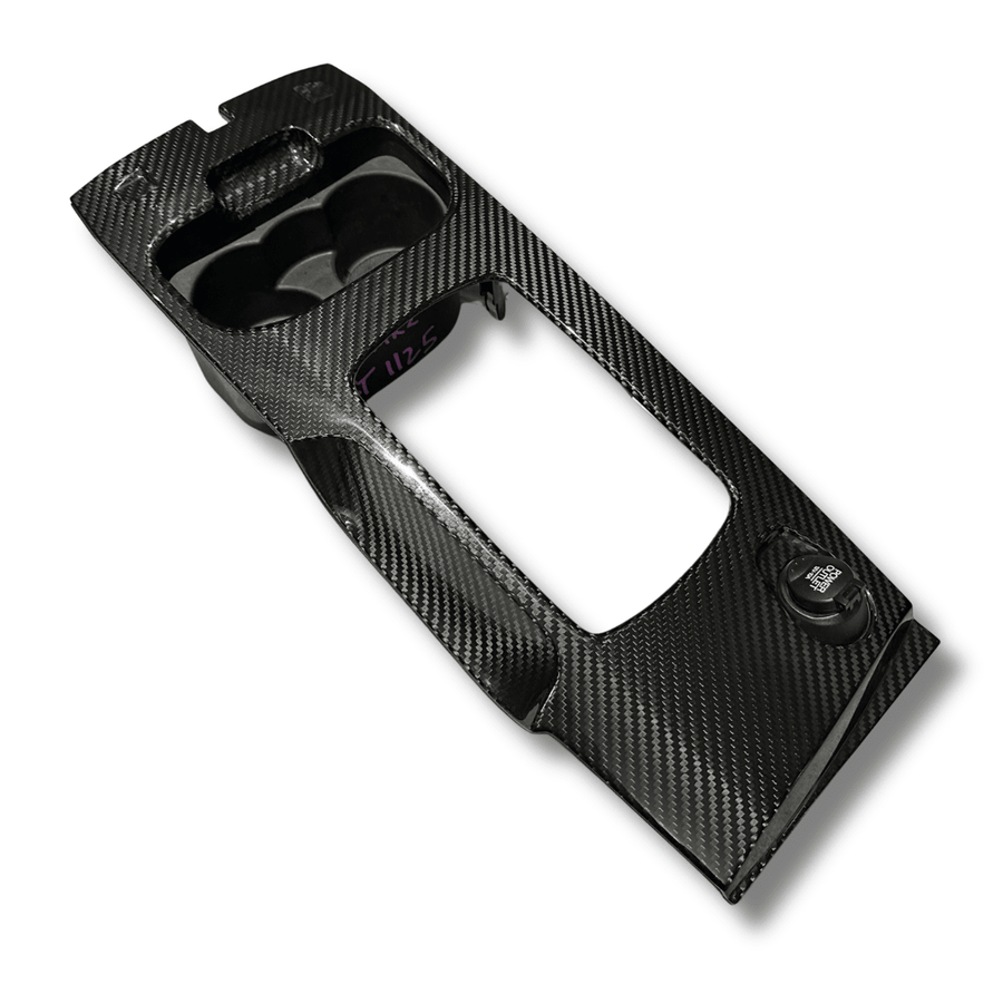 Gloss twill carbon fibre shifter surround for the Ford FG Falcon, angled view on white background