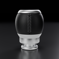 Front view of the FG/FG-X manual shift knob showing the leather seam and grey herringbone stitching, product render